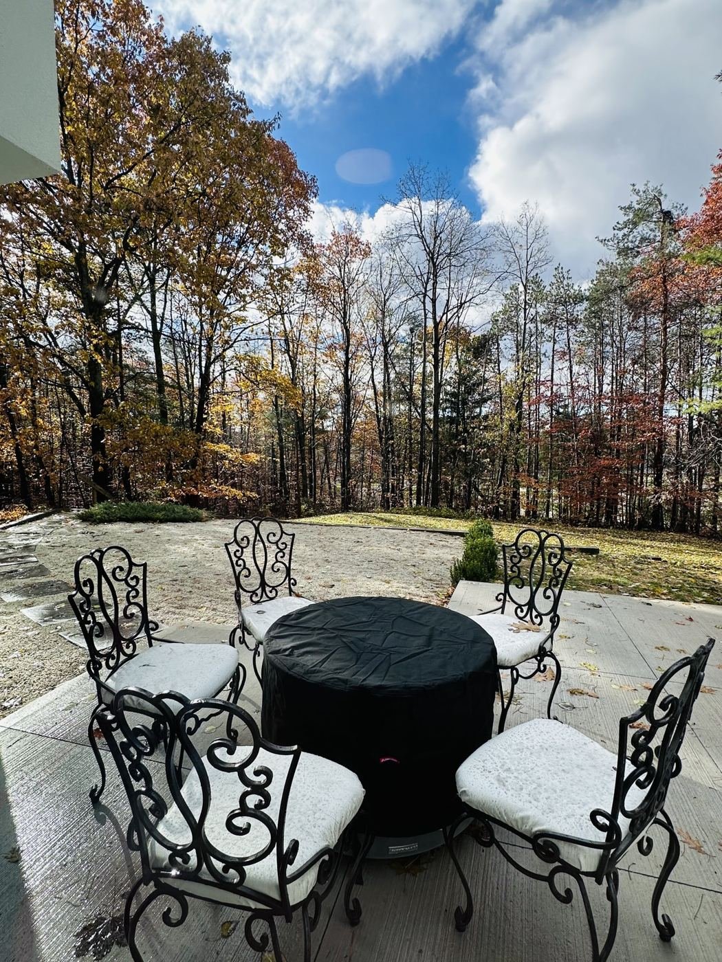 Private stone patio among mature trees at the Anända suite near Barrie